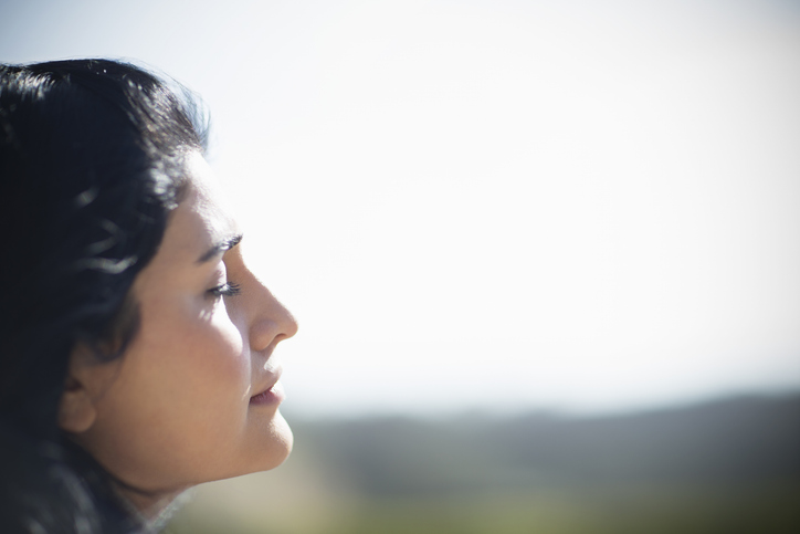 woman looking out of a window 