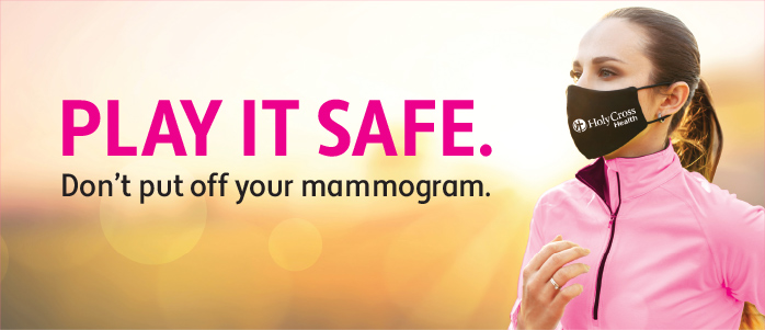 Masked woman in pink jacket jogging